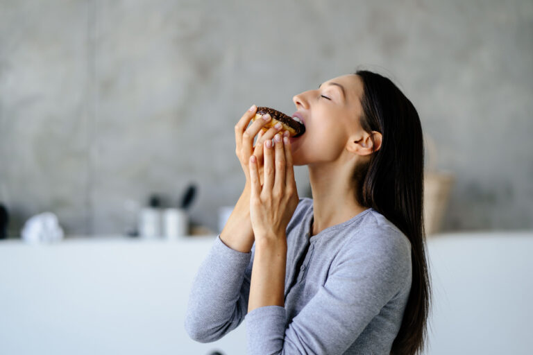 Portrait Rejoicing Woman Eats Tasty Donut Home Unhealthy Food Concept 768x512